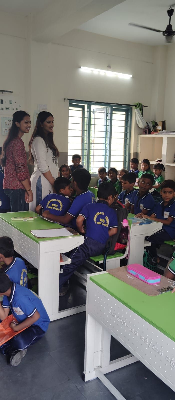 Ruthvika and Jasmitha with excited students at the start of the Read and Record baseline session